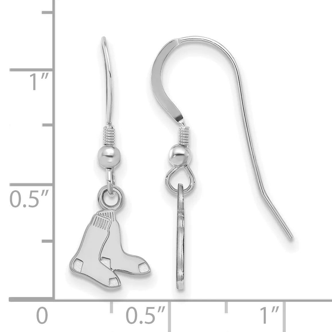 Silver-toned earrings with a pair of small baseball boots as pendants, displayed next to a measurement ruler showing approximately one inch in length.