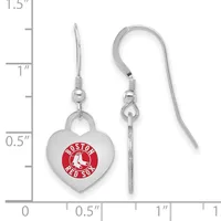 Silver-toned heart-shaped earrings with red enamel circular logo detail, suspended from silver ear wires, shown against a measurement scale.