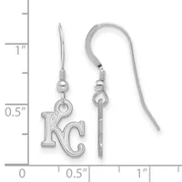 Pair of silver earrings with KC charm pendants and matching hooks, displayed next to a ruler showing approximately one inch in length.