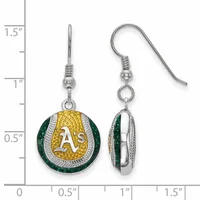 Pair of silver-toned drop earrings with green and gold enamel circular pendants featuring a baseball team logo, displayed against a measurement scale.
