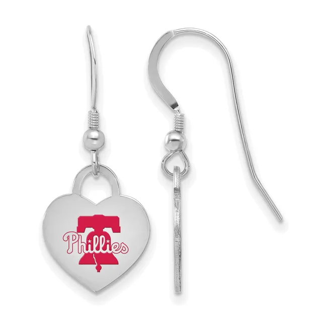 Pair of silver-toned heart-shaped dangle earrings with red enamel design and matching hooks shown from front and side views.