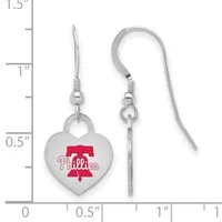Silver heart-shaped earrings with a red baseball team logo, shown next to a measurement ruler indicating approximately one inch in length.