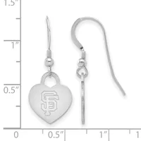 A pair of silver heart-shaped dangle earrings with an engraved SF logo, shown next to a ruler measuring approximately one inch in length.
