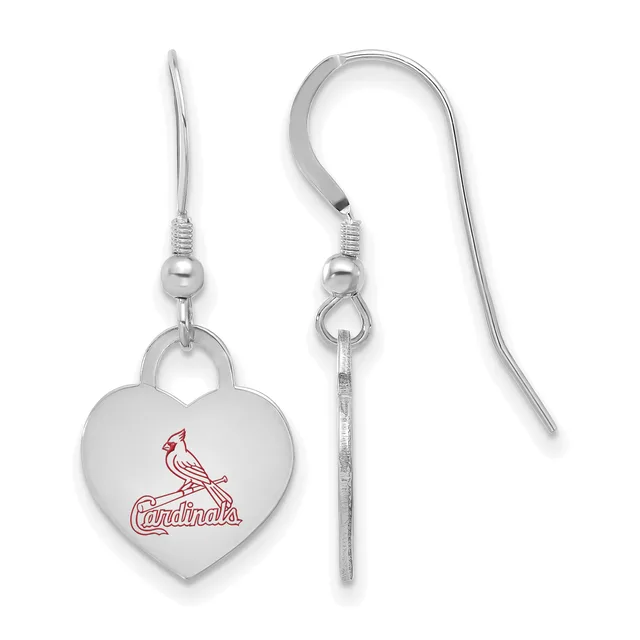 A pair of silver-toned heart-shaped earrings with a cardinal bird design in red, suspended from curved wire hooks.