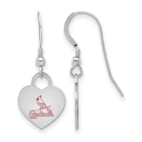 A pair of silver-toned heart-shaped earrings with a cardinal bird design in red, suspended from curved wire hooks.
