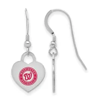 A pair of silver-toned heart-shaped earrings with fish hook wires, featuring a red circular logo on the front of each heart.