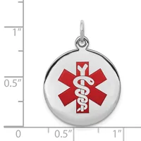 Round silver medical alert pendant with red star of life symbol and white staff, shown next to a ruler measuring approximately one inch in diameter.