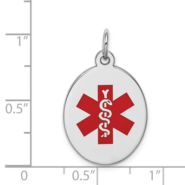 Oval medical alert pendant with red star of life symbol and white caduceus on silver background, shown next to ruler indicating approximately one inch in height.
