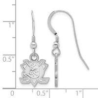Silver hockey puck and crossed sticks earrings with fish hook wires displayed next to a ruler showing approximately one inch in length.