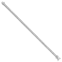 Silver tennis bracelet with square-cut clear gemstones set in a continuous line, displayed diagonally against a white background.