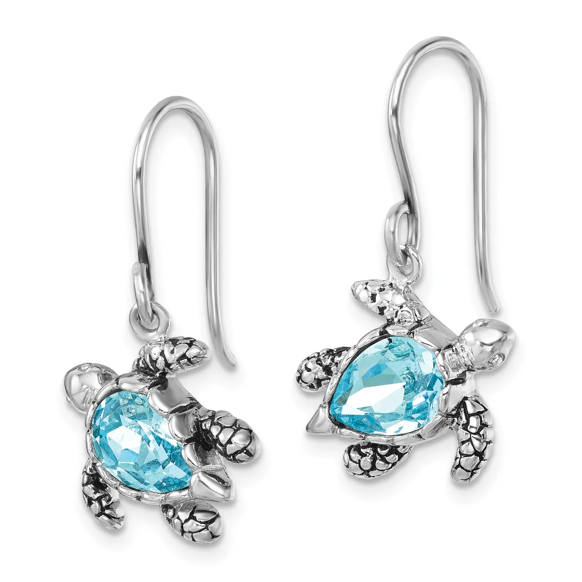 Pair of silver turtle-shaped dangle earrings with teardrop-cut blue topaz stones and textured shells, suspended from curved ear wires.