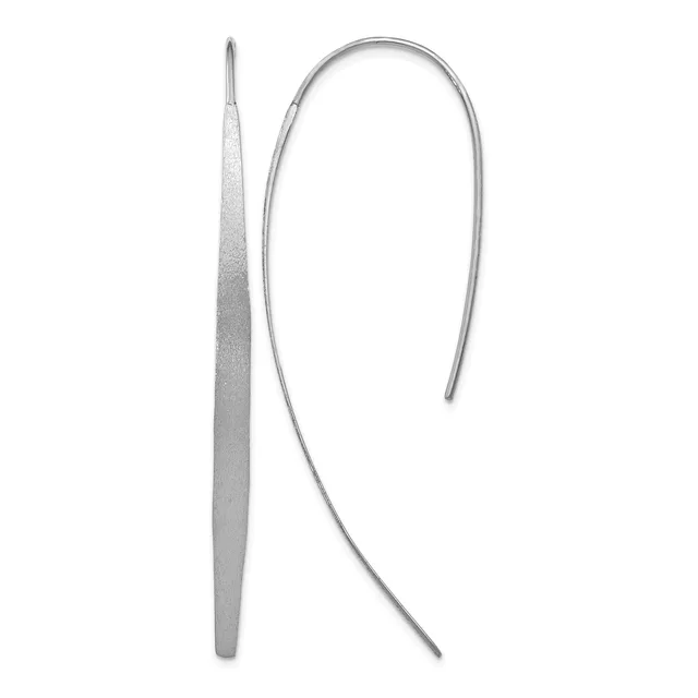 A pair of silver threader earrings consisting of a long tapered needle on the left and a curved wire on the right.