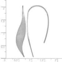 Two silver earrings shown against a ruler measuring up to two inches: one curved leaf-shaped earring with a textured surface, and one simple curved hook earring.