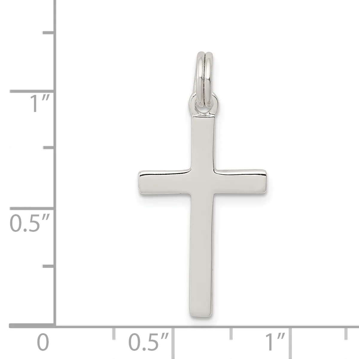 Sterling silver cross pendant shown against a ruler measuring approximately one inch tall and half an inch wide.