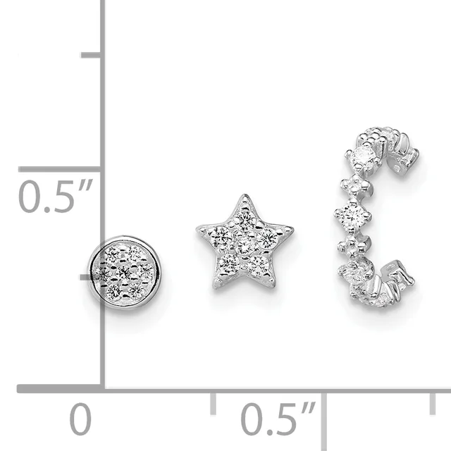 Three silver jewelry pieces with cubic zirconia stones displayed on a measurement grid: a circular pendant, a star-shaped pendant, and an open-work curved earring.