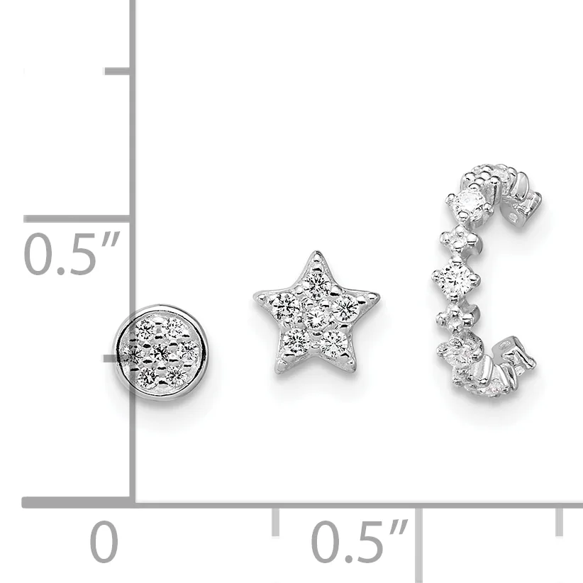 Three silver jewelry pieces with cubic zirconia stones displayed on a measurement grid: a circular pendant, a star-shaped pendant, and an open-work curved earring.