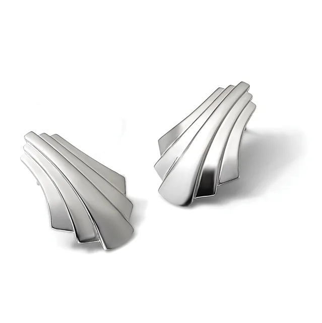 Two pairs of metallic curved drawer pulls or cabinet handles with fan-like ribbed designs, shown from above with shadows.