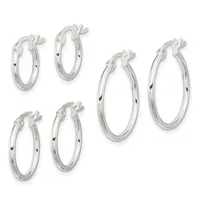 Three pairs of polished silver hoop earrings in varying sizes, each with a hinged clasp closure, arranged against a white background.