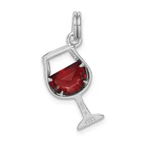 Sterling silver charm shaped like a wine glass with a deep red faceted crystal stone filling the bowl and a small stamped hallmark on the stem.
