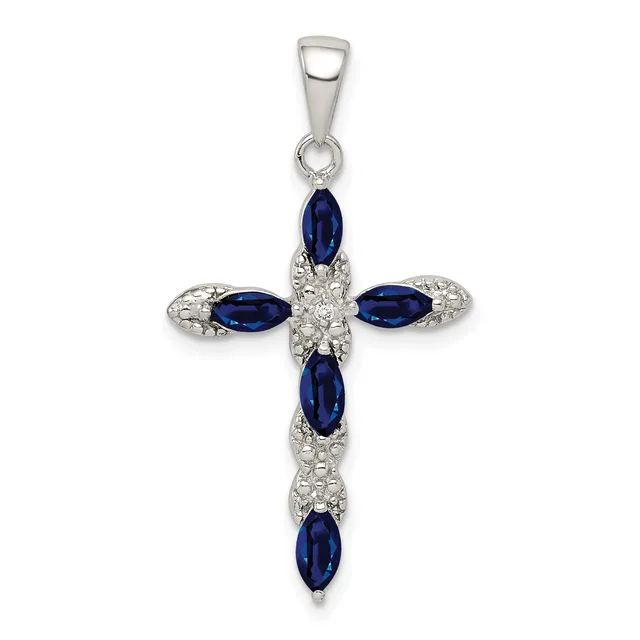 Silver cross pendant with five oval blue sapphires and white diamond accents, suspended from a silver bail.