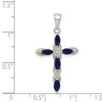 Silver cross pendant with five oval blue sapphires and diamond or crystal accents, displayed against a ruler showing approximately 1.25 inches in length.