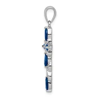 Vertical silver pendant charm with three oval blue stones alternating with small diamond accents, attached to a silver loop bail.