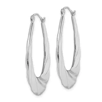A pair of polished silver oval hoop earrings with a twisted surface design and hinged closures, displayed against a white background.
