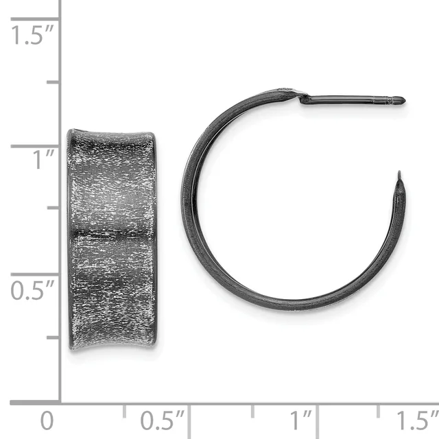 A pair of textured silver hoop earrings shown front and side view next to a measurement scale indicating approximately one inch in diameter.