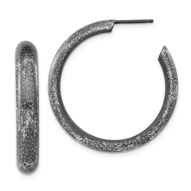 A pair of textured silver hoop earrings with a sparkly finish, shown from the front against a white background.