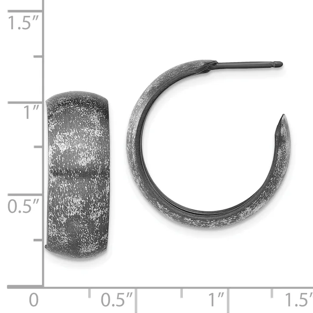 Two oxidized silver hoop earrings with a textured finish, shown next to a ruler indicating they measure approximately one inch in height.
