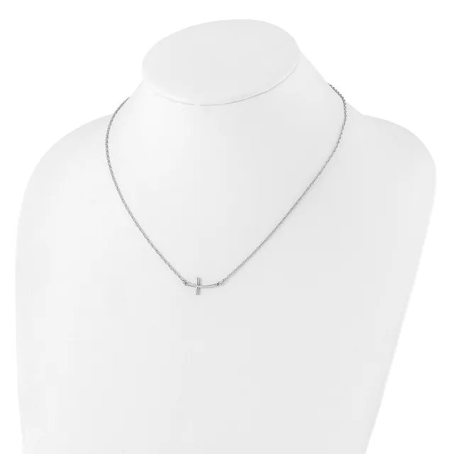 Silver-toned delicate chain necklace with a small cross pendant, displayed on a white mannequin bust.