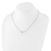 Silver-toned delicate chain necklace with a small cross pendant, displayed on a white mannequin bust.