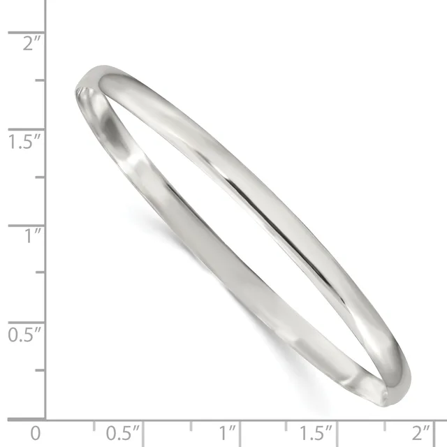 A polished silver bangle bracelet with a smooth, curved design shown against a measurement scale indicating it is approximately 2 inches in diameter.