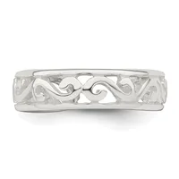 Silver ring with an ornate openwork band featuring scrolling curved designs, photographed from above against a white background.