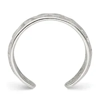Open silver cuff bracelet with a textured hammered finish on the outer surface, shown against a white background.
