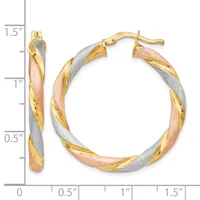 Pair of tricolor gold twisted hoop earrings with yellow, white, and rose gold sections, shown next to a measurement scale indicating approximately 1.5 inches in length.