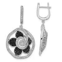 Pair of silver dangle earrings with ornate circular pendants featuring black and clear cubic zirconia stones arranged in a floral swirl pattern, shown from front and side views.