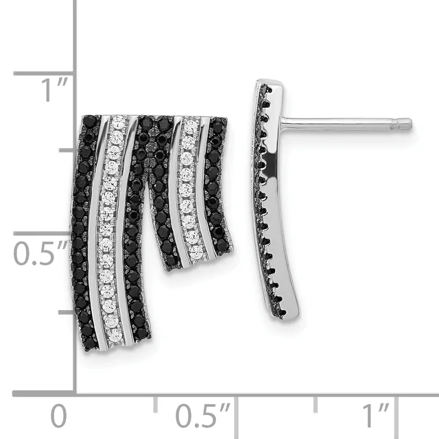 A pair of silver earrings with alternating rows of black and white diamonds in a curved, layered design, shown against a measurement scale.