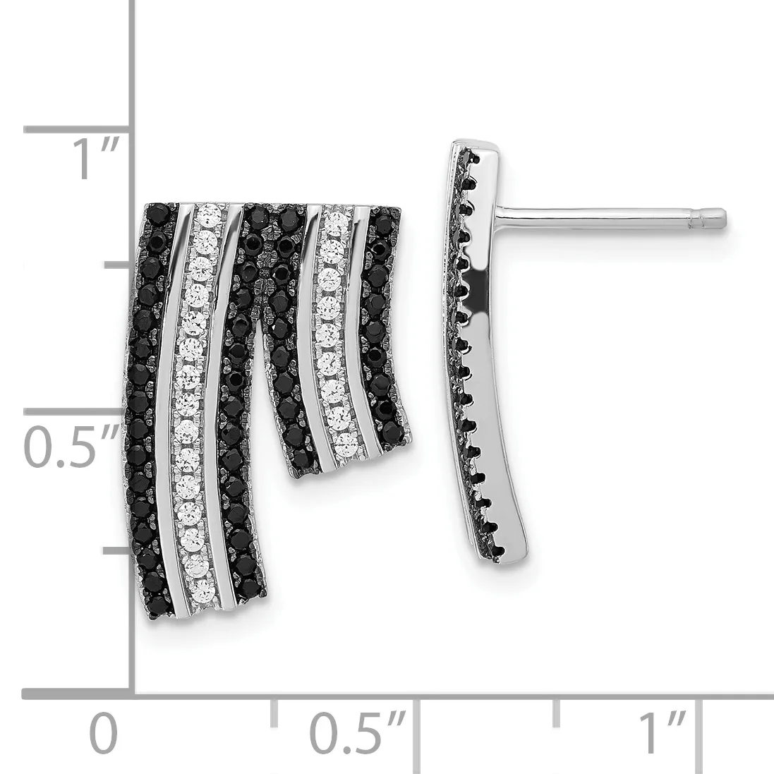 A pair of silver earrings with alternating rows of black and white diamonds in a curved, layered design, shown against a measurement scale.