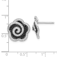 A pair of silver flower-shaped stud earrings with black and white round stones arranged in a spiral pattern, shown front and side view next to a measurement scale.
