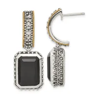A pair of two-tone dangle earrings featuring rectangular black onyx stones surrounded by textured metalwork with twisted gold-tone trim on the upper hoops.