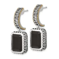 Pair of two-tone drop earrings with curved gold-trimmed tops studded with small stones and rectangular black onyx pendants surrounded by beaded silver settings.
