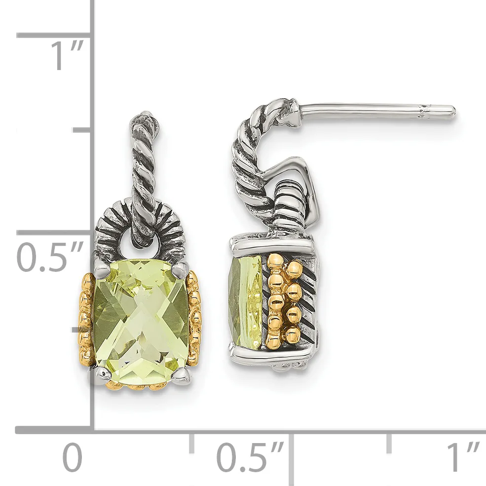 Pair of silver and gold drop earrings with twisted rope details and rectangular faceted pale yellow-green gemstones, shown against a measurement scale.