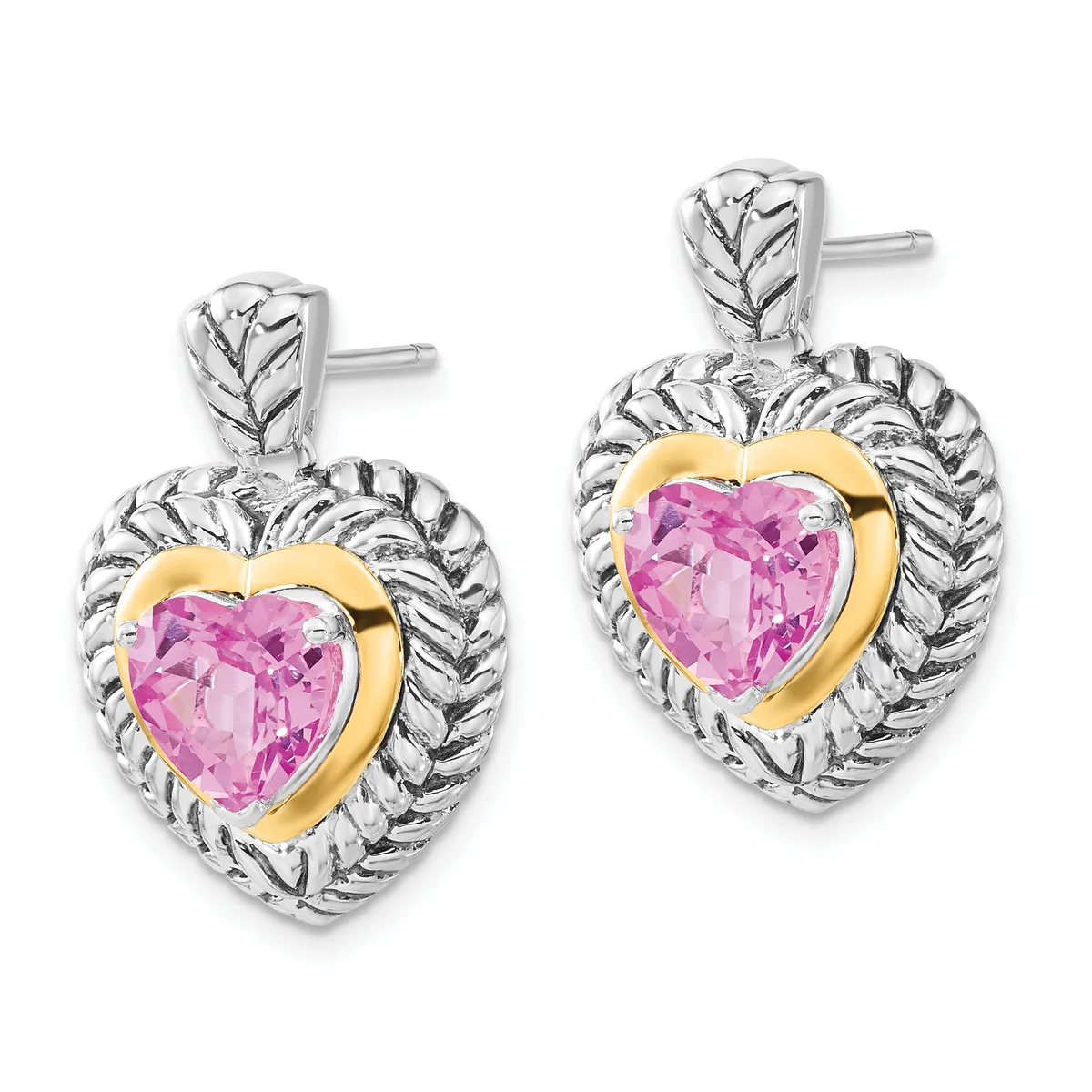 A pair of heart-shaped earrings featuring pink gemstones in gold bezels surrounded by textured silver rope-style frames with stud posts.