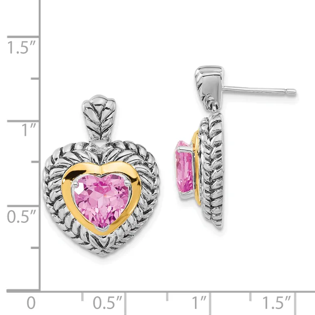 Two-tone heart-shaped earrings with pink faceted stones surrounded by twisted silver bezels and gold accents, shown front and side view with measurement scale.