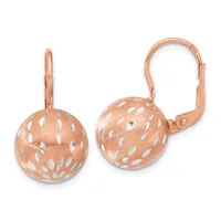 A pair of rose gold spherical leverback earrings with a textured finish and white enamel leaf pattern throughout.