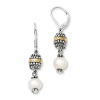 Pair of silver dangle earrings with ornate beaded caps in two-tone silver and gold, each suspending a white pearl, shown on white background.