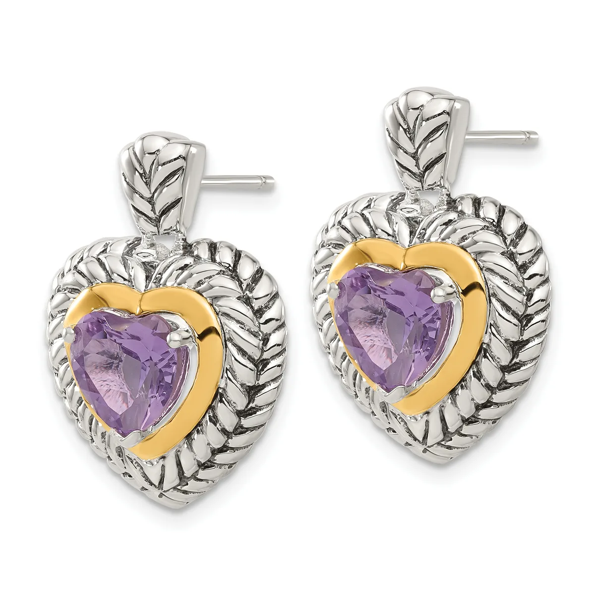 Pair of silver and gold heart-shaped earrings with purple amethyst centers and textured leaf detailing, shown on posts.