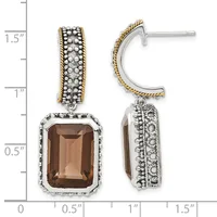 Two-tone silver and gold dangle earrings with smoky quartz rectangular stones surrounded by beaded frames, displayed against a measurement scale.