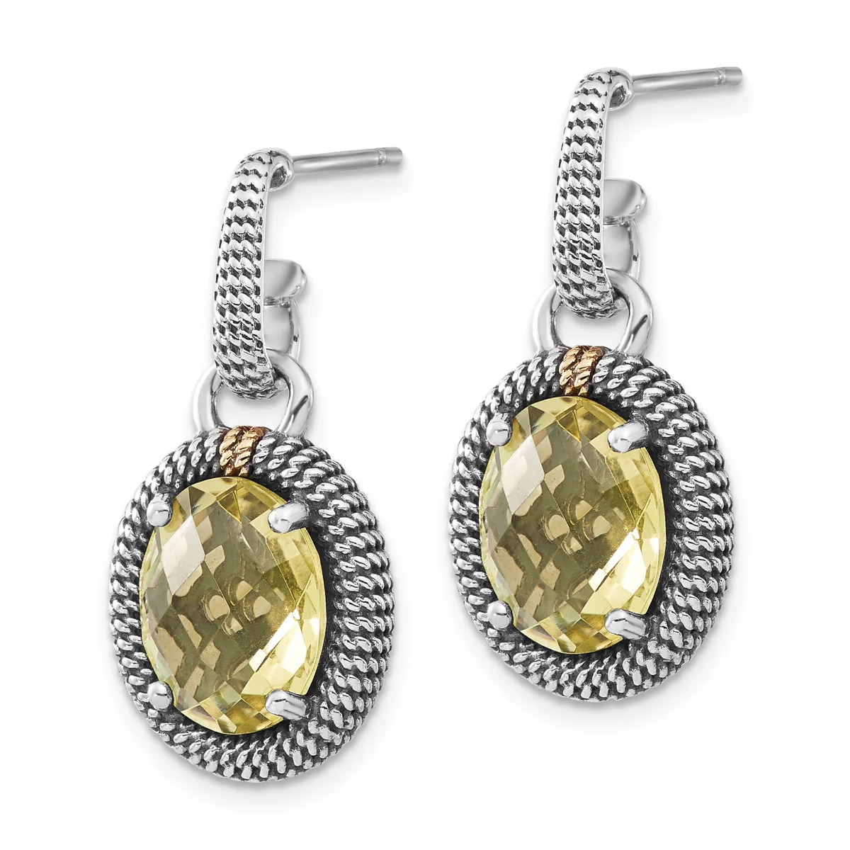 A pair of silver drop earrings with twisted rope bezels surrounding faceted oval yellow gemstones, shown against a white background.